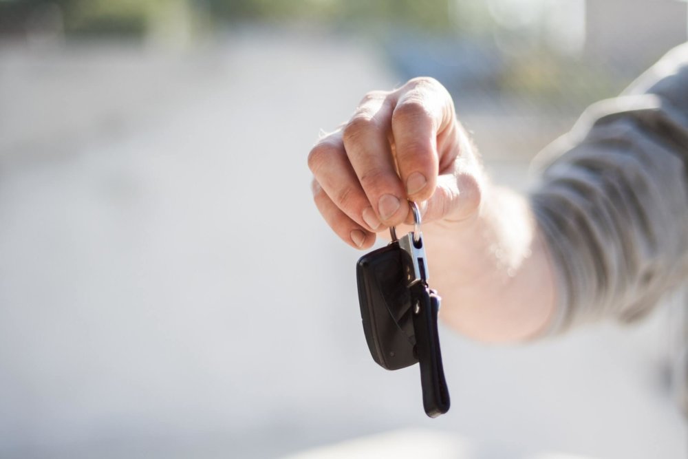 Person holding car keys