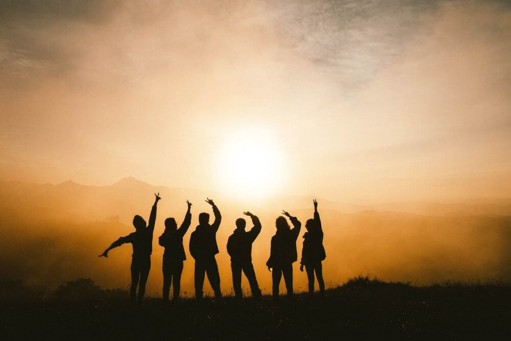 group of people outside in the evening after using long-distance moving services 