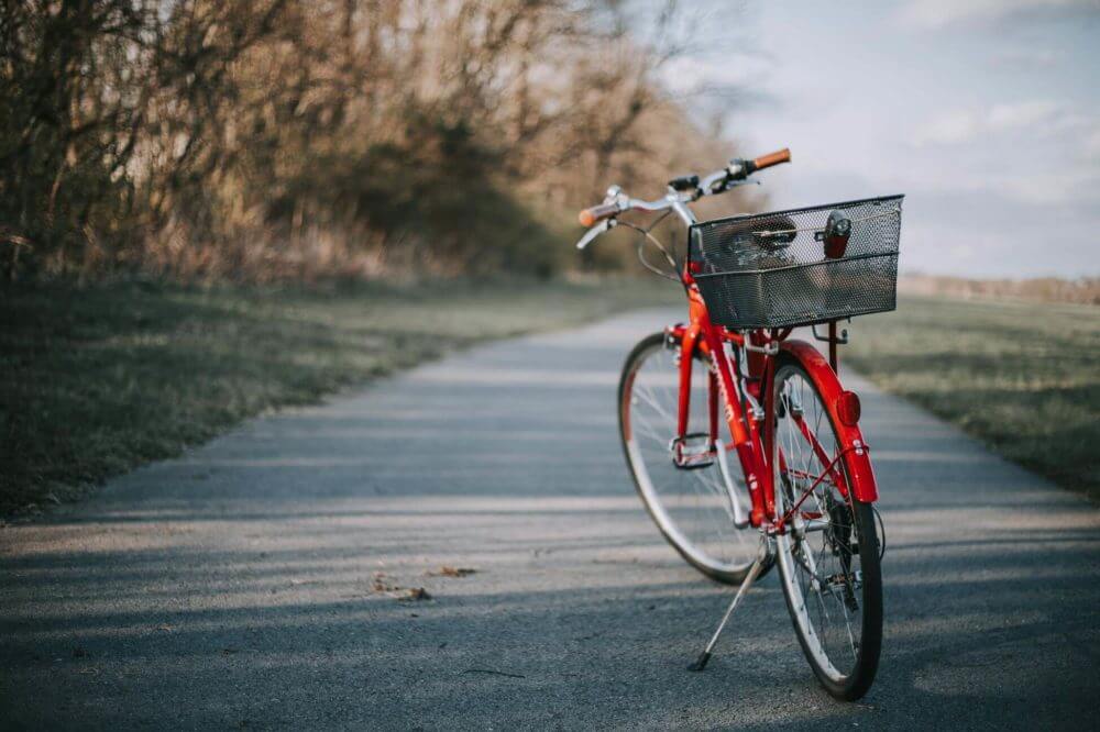 A man with a bicycle walking in Chicago