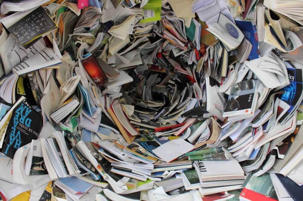 A pile of books, magazines, and papers