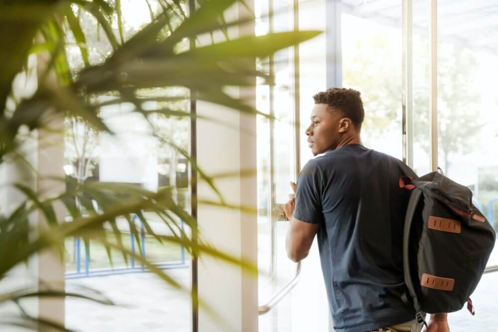 guy carrying a backpack