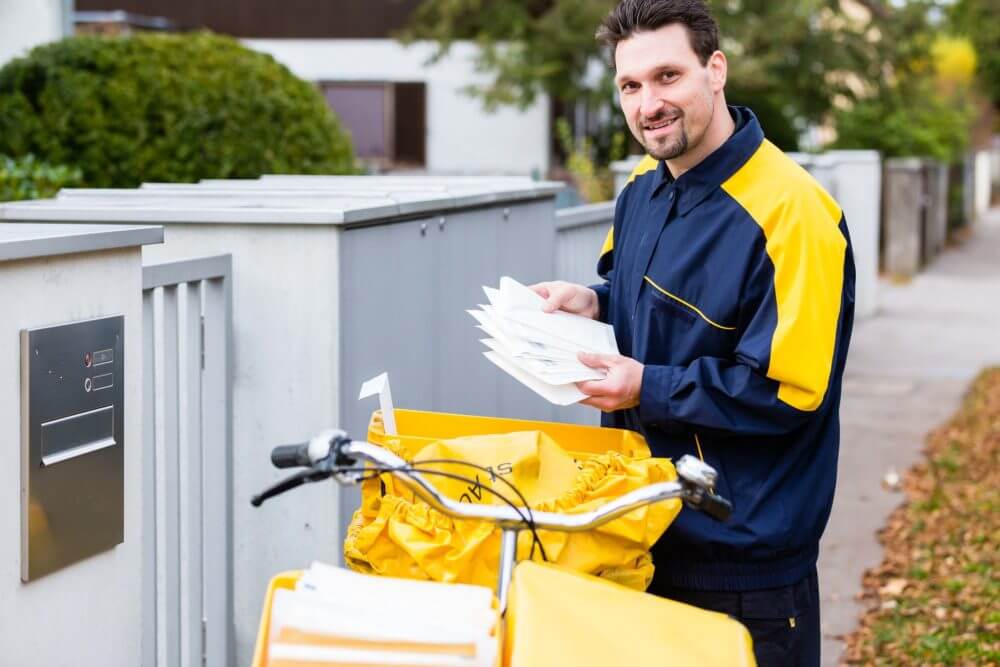 postman carrying letters 