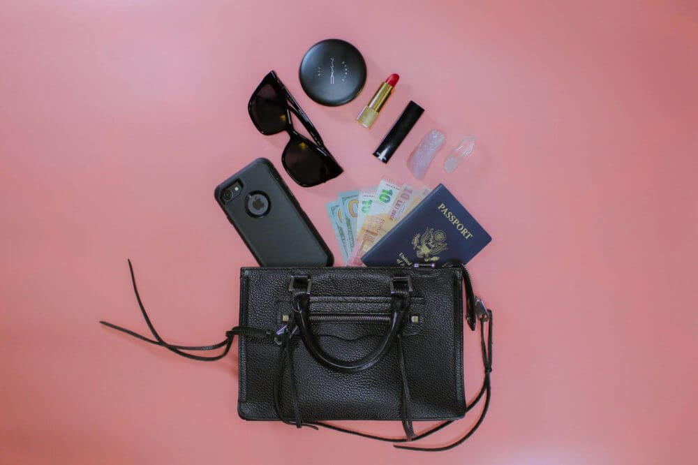 a purse on a pink background