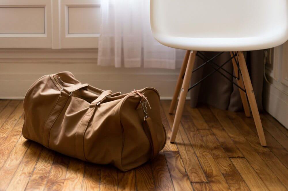 Leather duffel bag on the floor