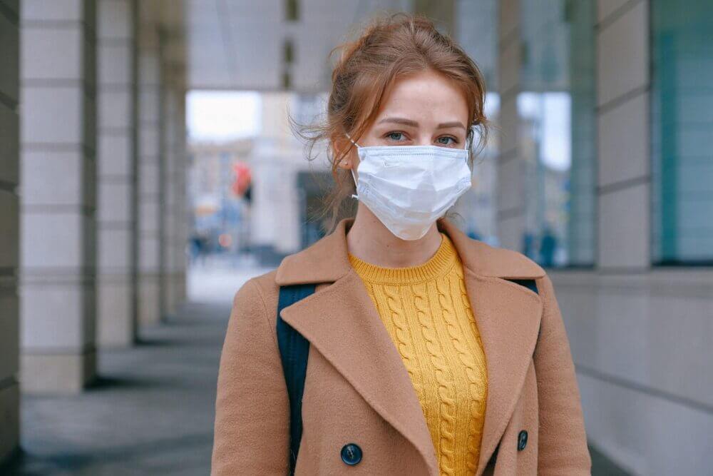 girl wearing a protective face mask