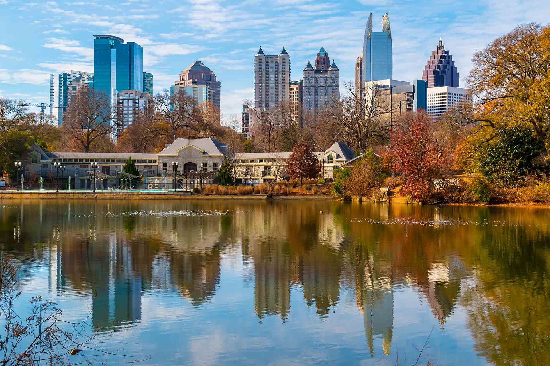 View of Lake Clara Meer, Piedmont Park Aquatic Center and Midtown Atlanta in sunny autumn day, USA