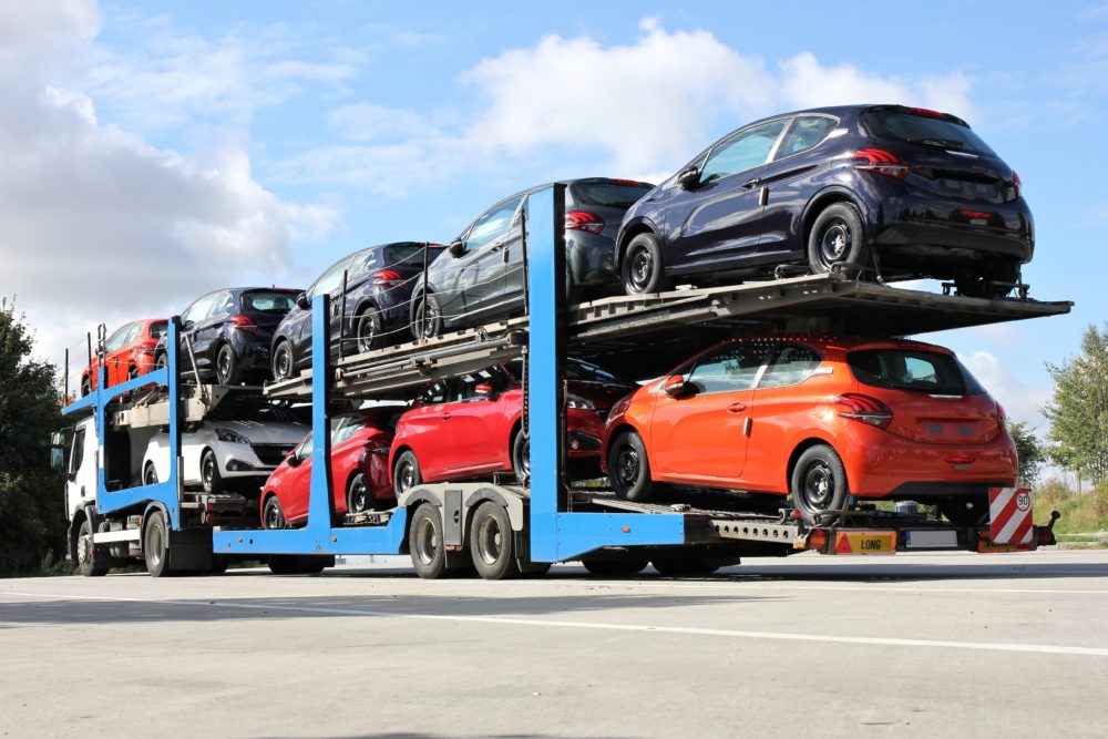 cars stacked on open trailer