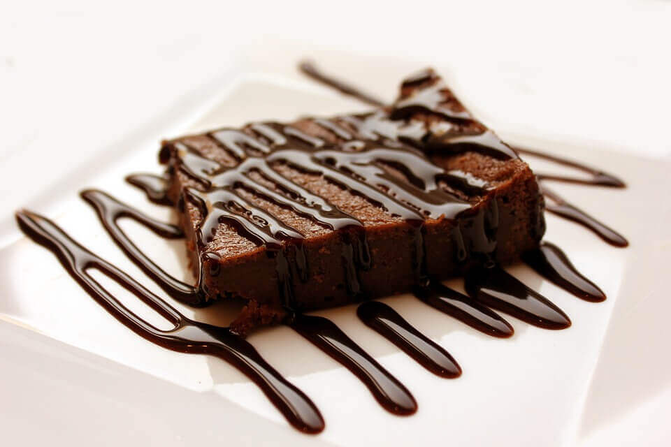 Delicious brownies with melted chocolate on a stack