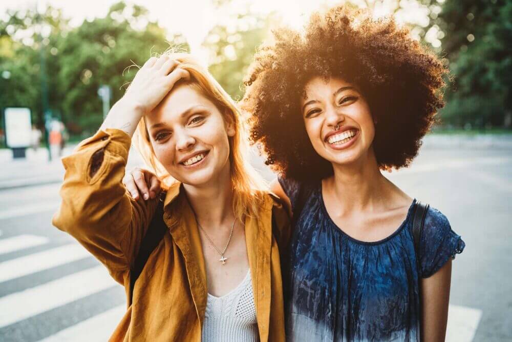 Two women standing in the street