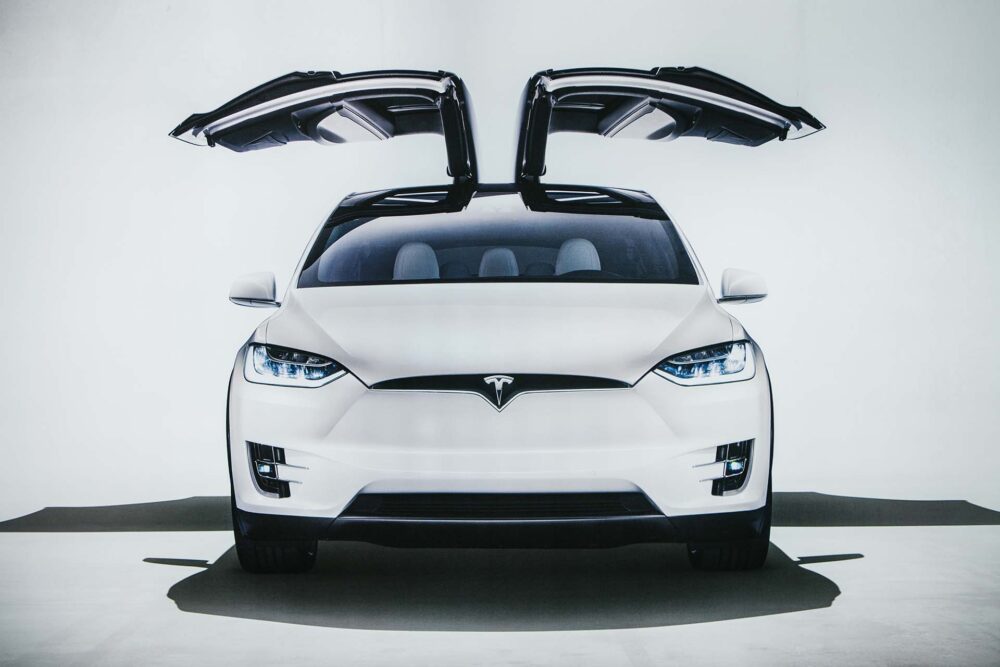 Photo of the image of an electric vehicle Tesla model X at the Tesla motor show in Berlin. A modern electric car