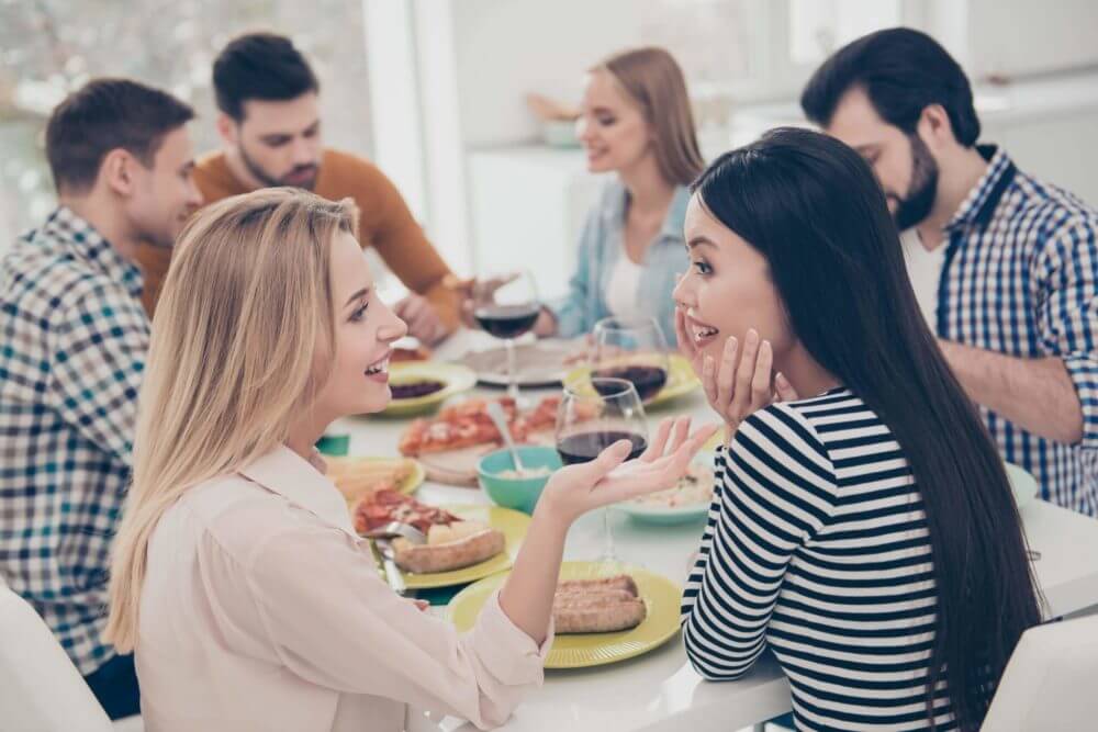 Six friends sitting in a restaurant 