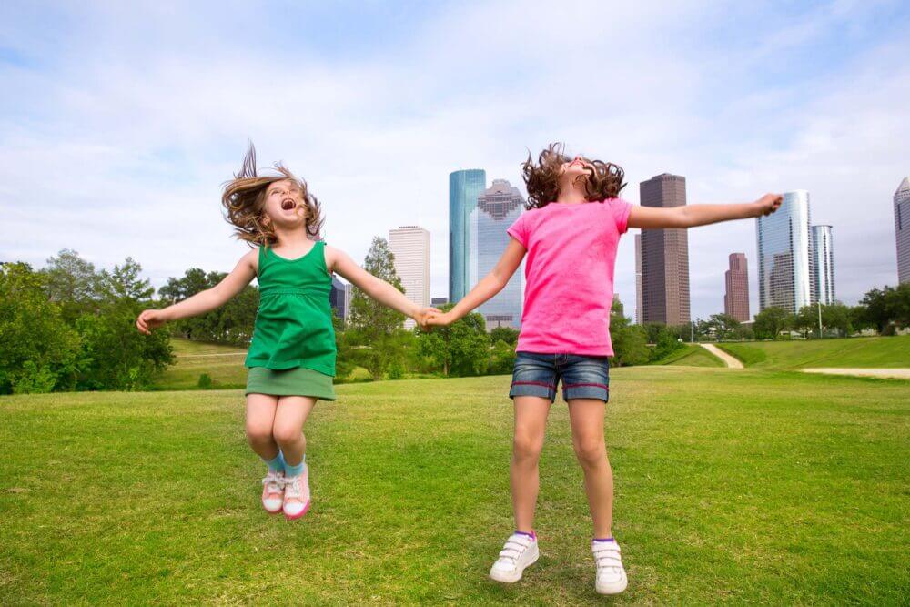 Two girls playing in a park