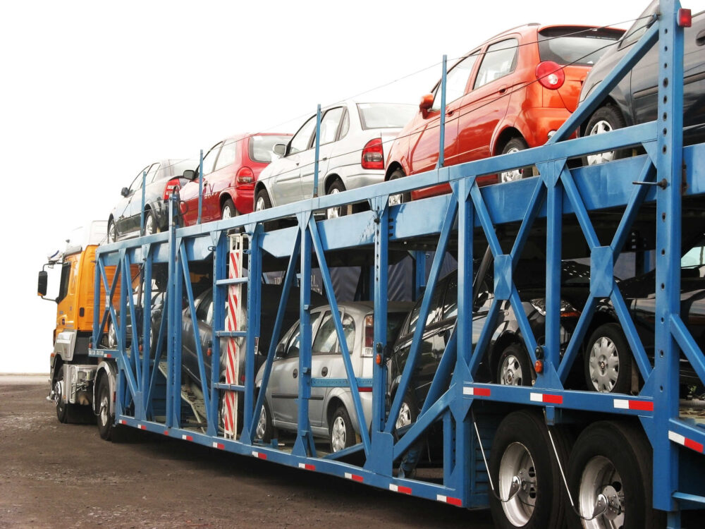 An open trailer truck shipping cars