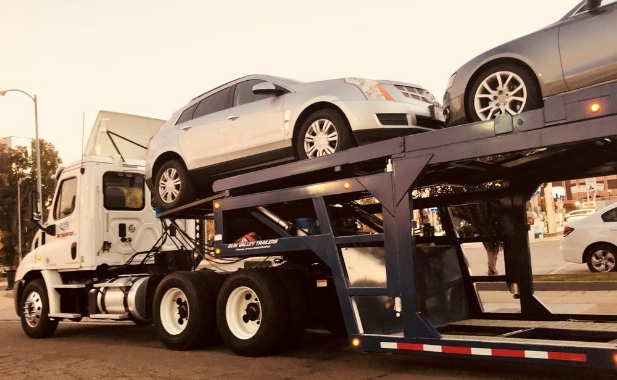 a trailer stacked with cars