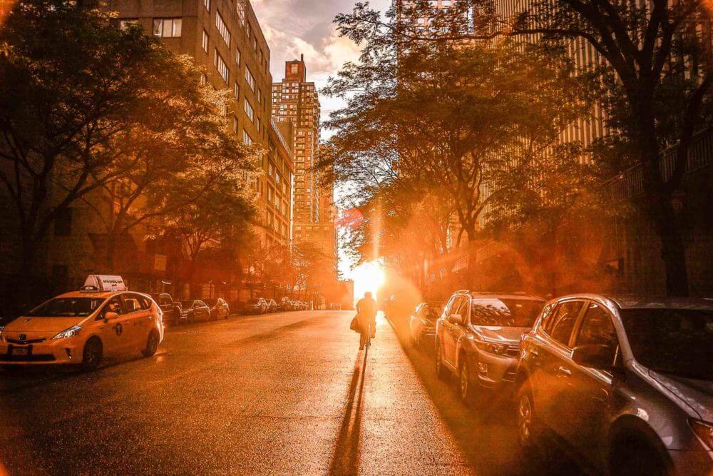 Person riding a bike in NYC after cross-country moving