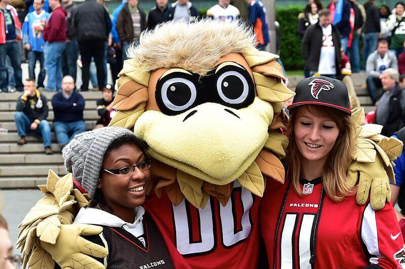 a mascot with two people