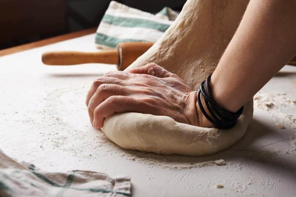 Preparing pizza dough 