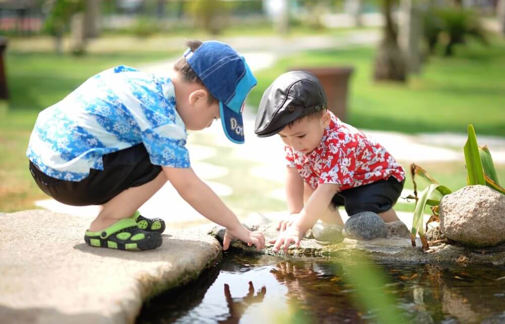 children playing in the pond