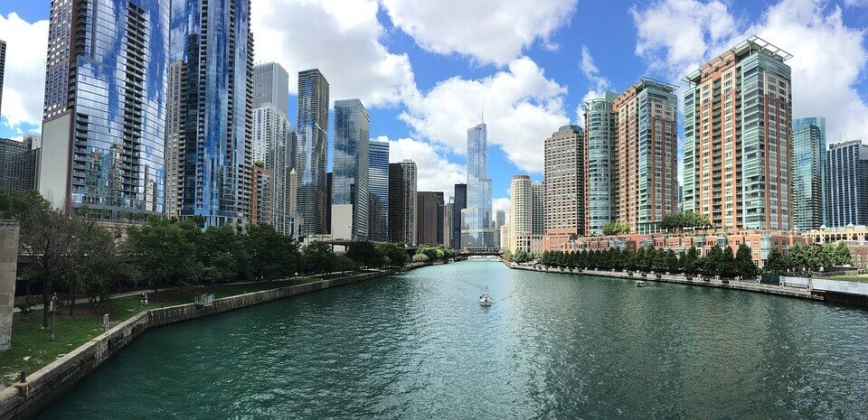 An image of a city's architecture and a lake.