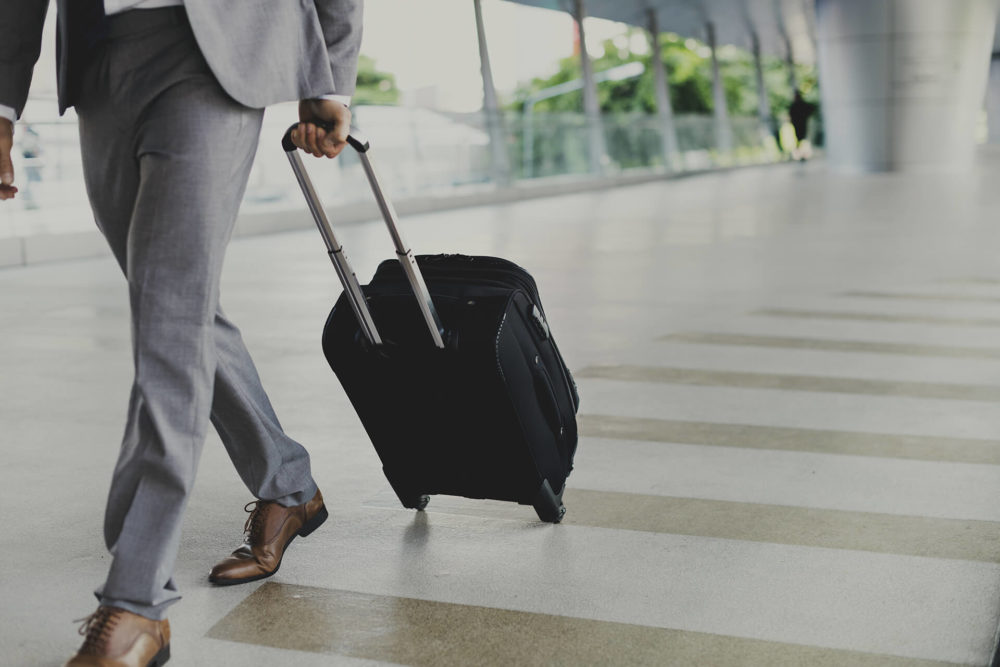 A man at the airport with luggage