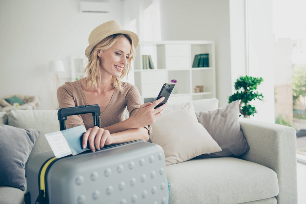 A girl looking at her phone and smiling