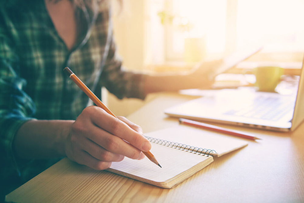  A woman writing a checklist