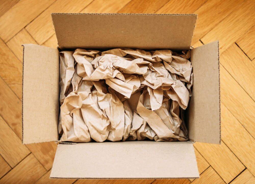 box filled with crumpled paper 