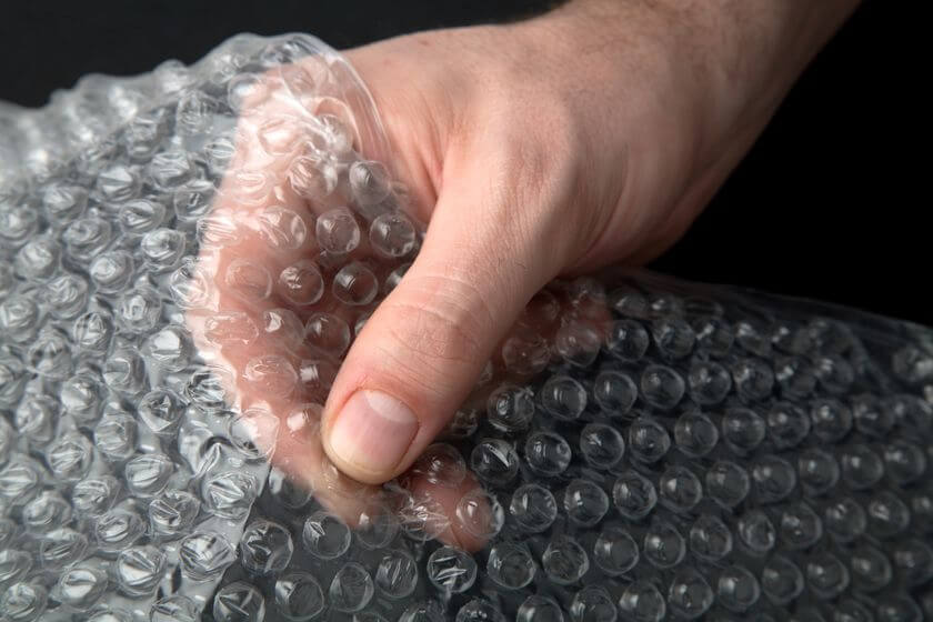 Hand holding bubble wrap