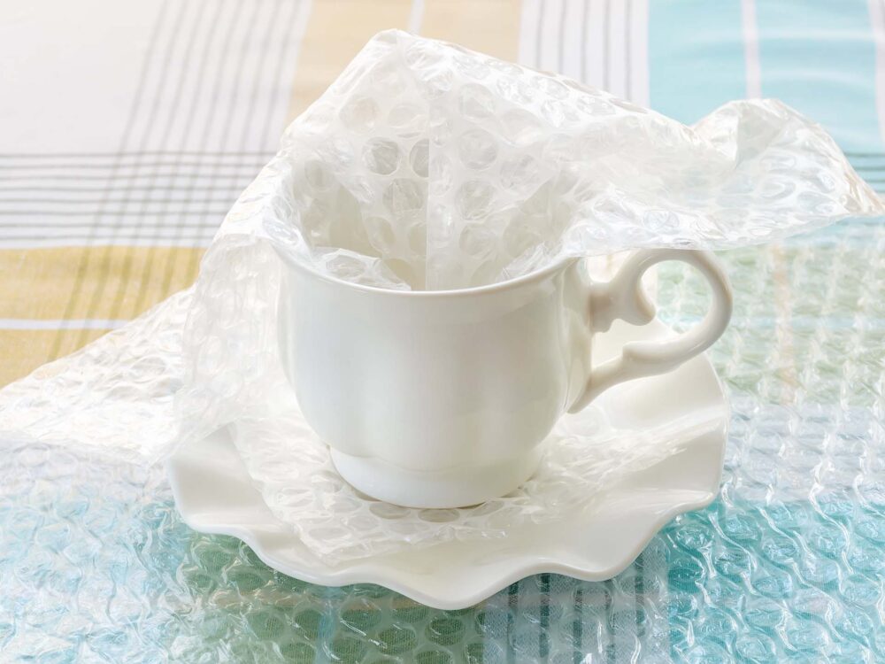 A porcelain tea cup and bubble wrap