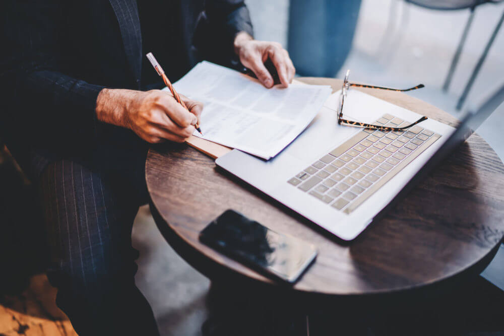 Man writing documents