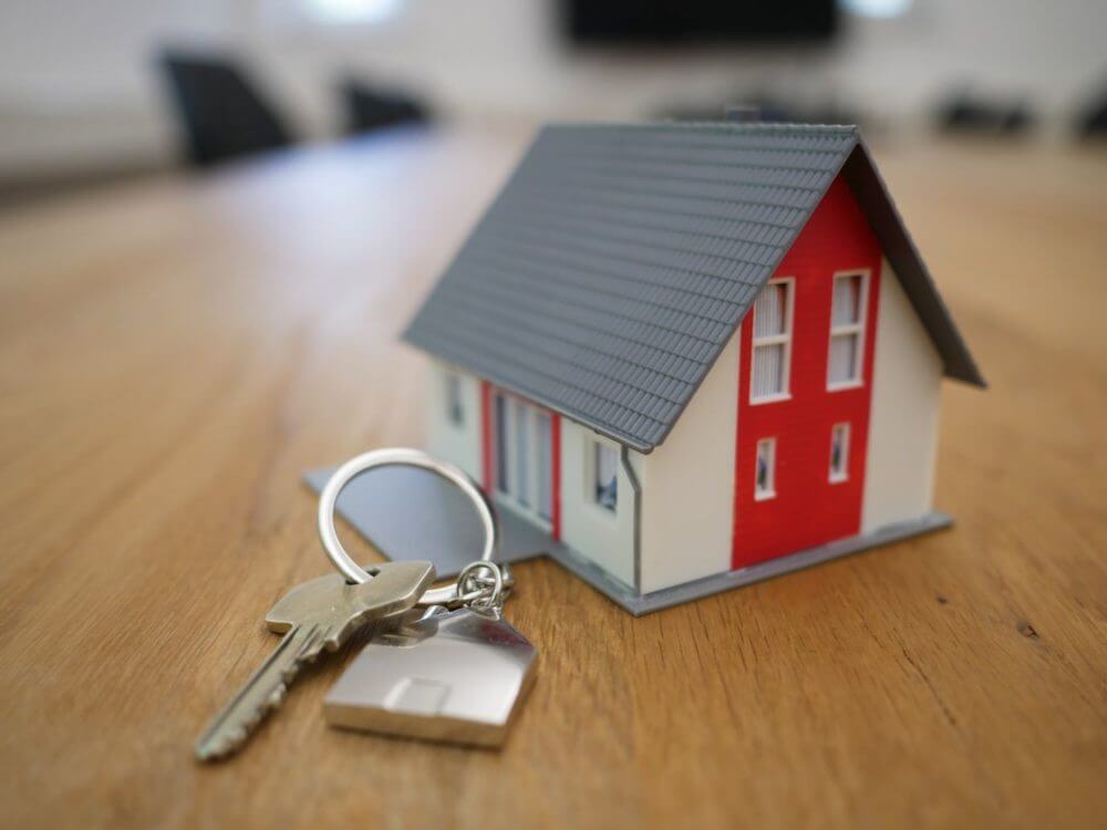 model of a house and a key