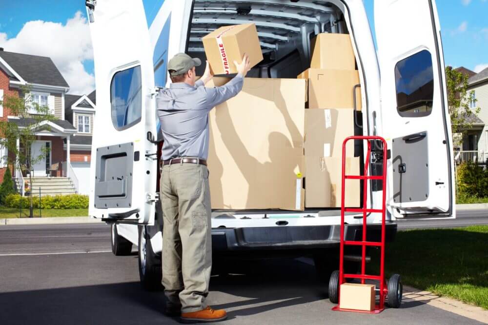 mover and a dolly by the truck