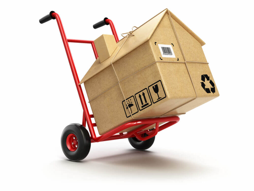 A dolly carrying a house-looking box