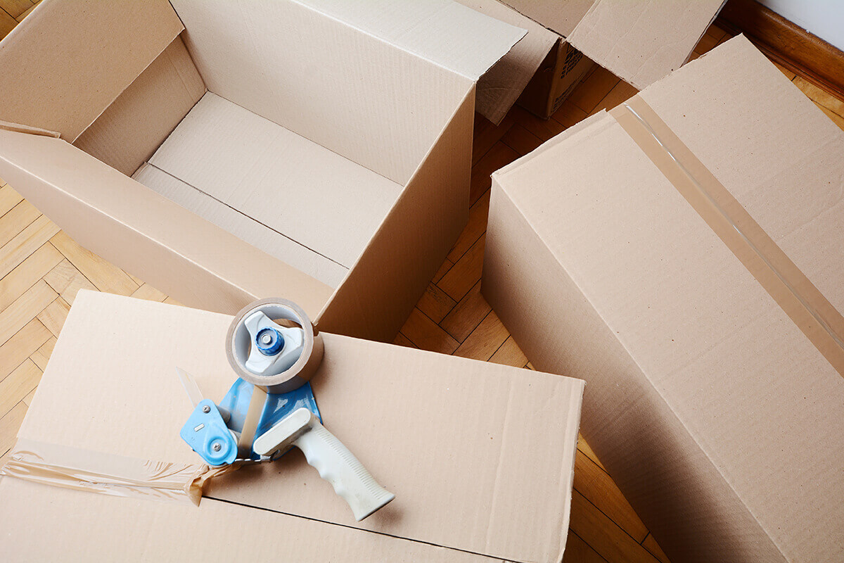 Boxes and duct tape on a tape dispenser