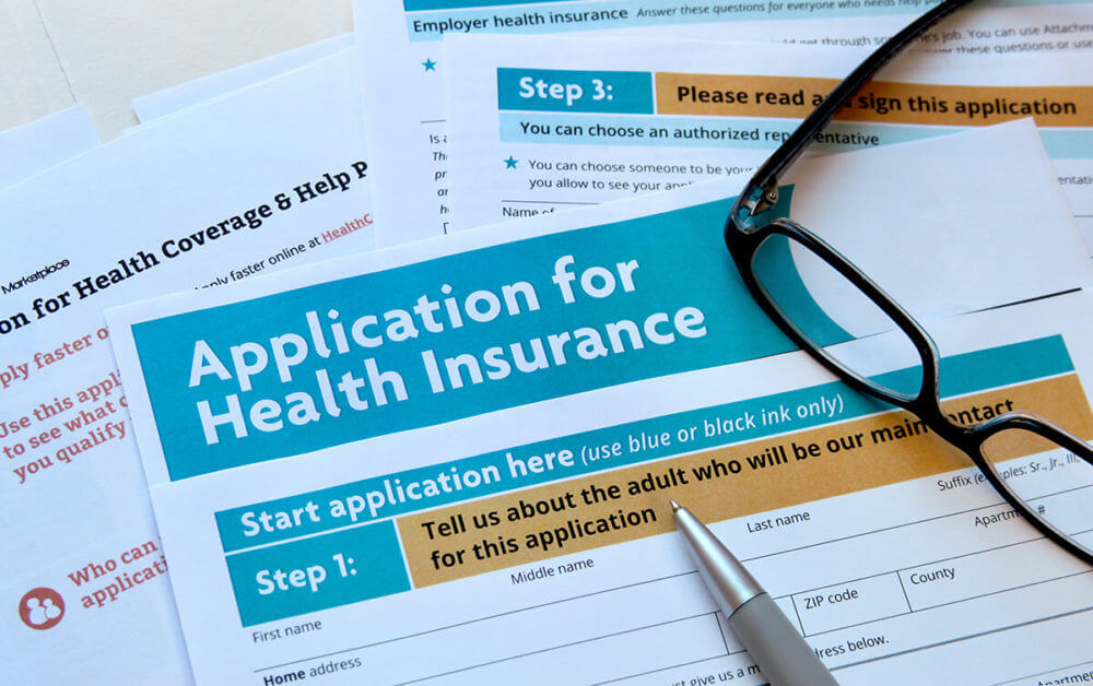 An application form for health insurance that needs to be filled after long-distance moving