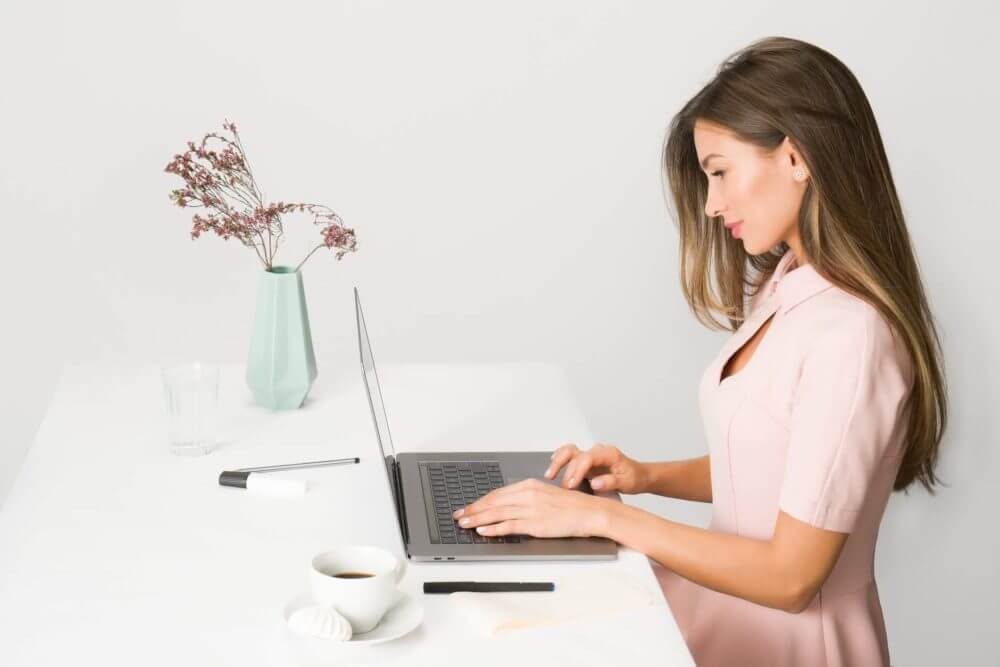 A girl working on a computer after a long-distance moving