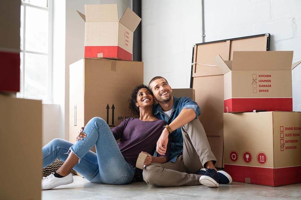 A happy couple planning their long-distance moving