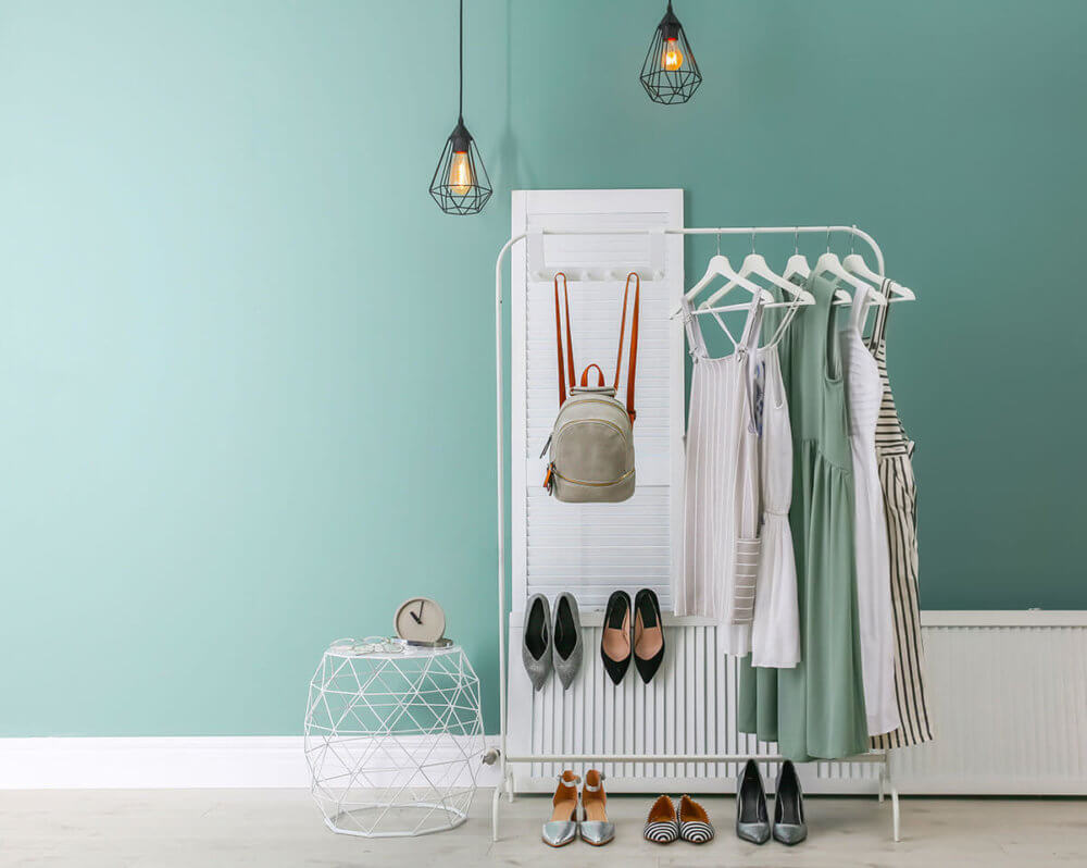 Dresses hanging on a clothing rack ready for long-distance moving