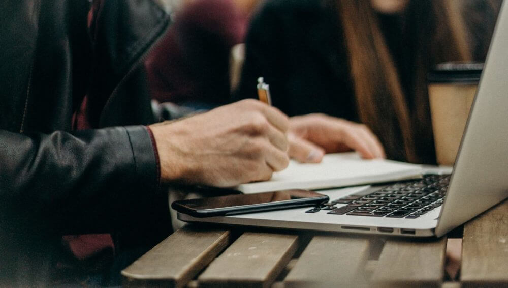 A man taking notes for long-distance moving