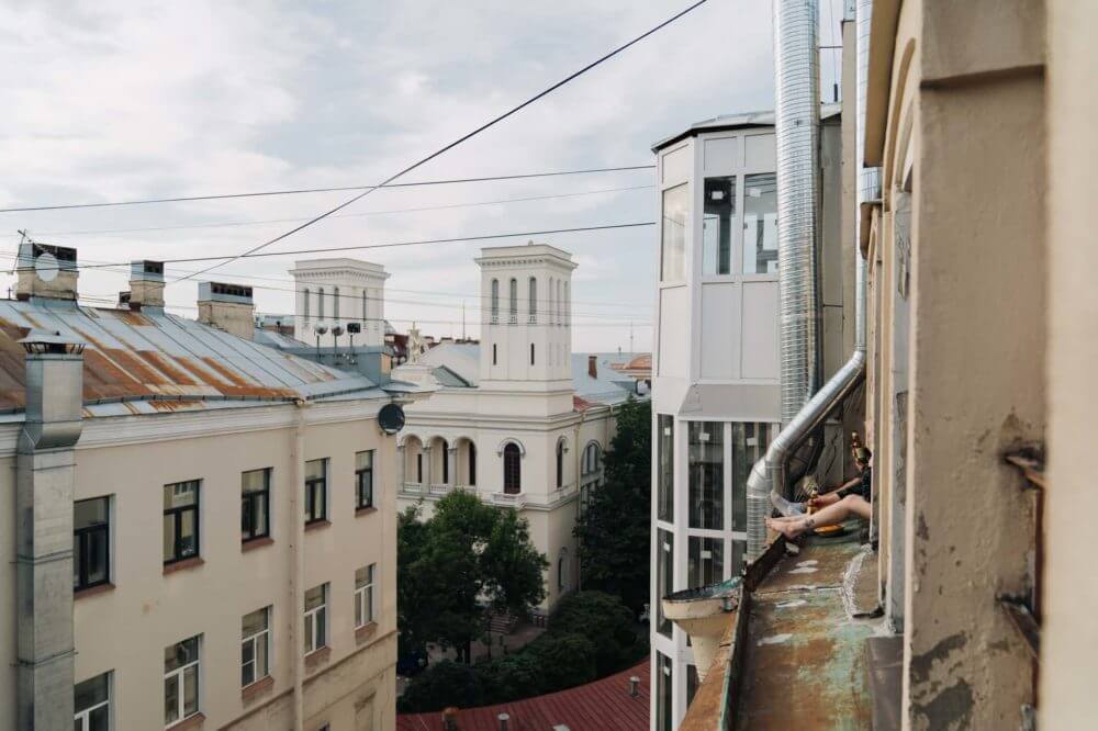 white and brown buildings in a neighborhood with trees