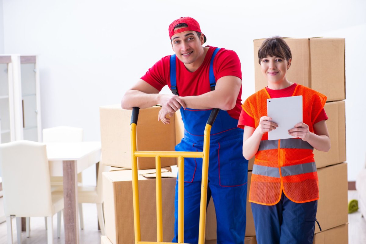 Professional long distance movers preparing items for cross country moving