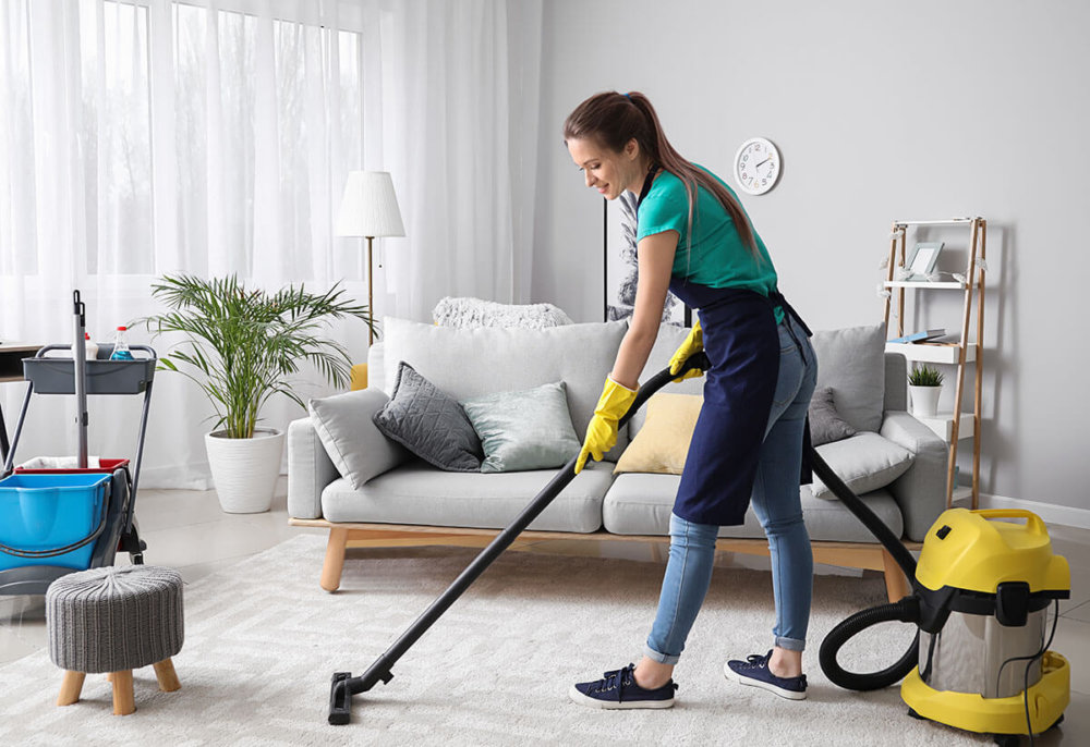 A woman vacuuming 