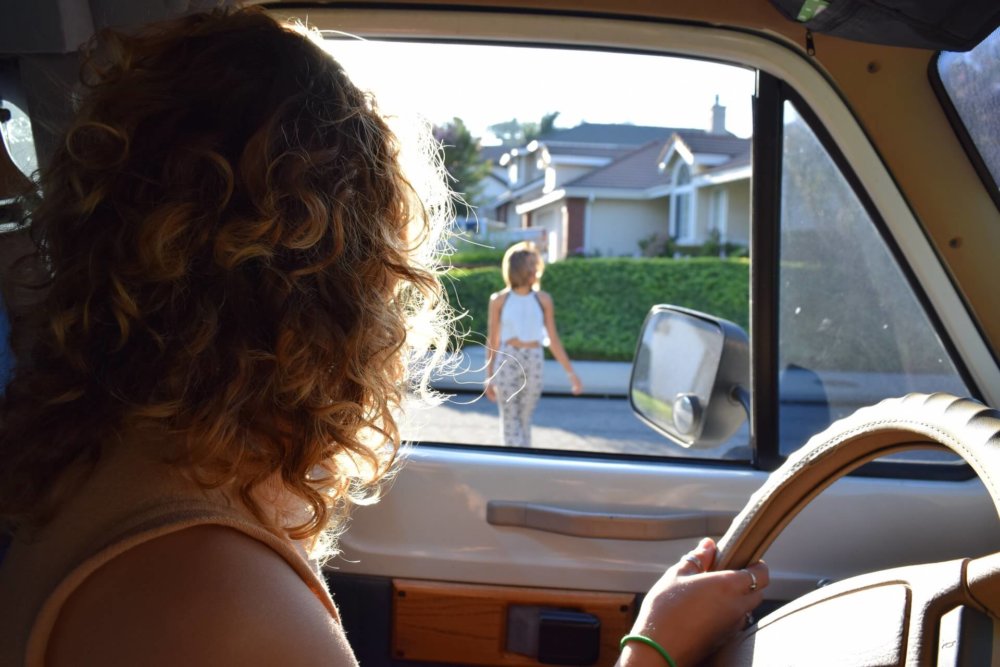 A woman looking through the car window