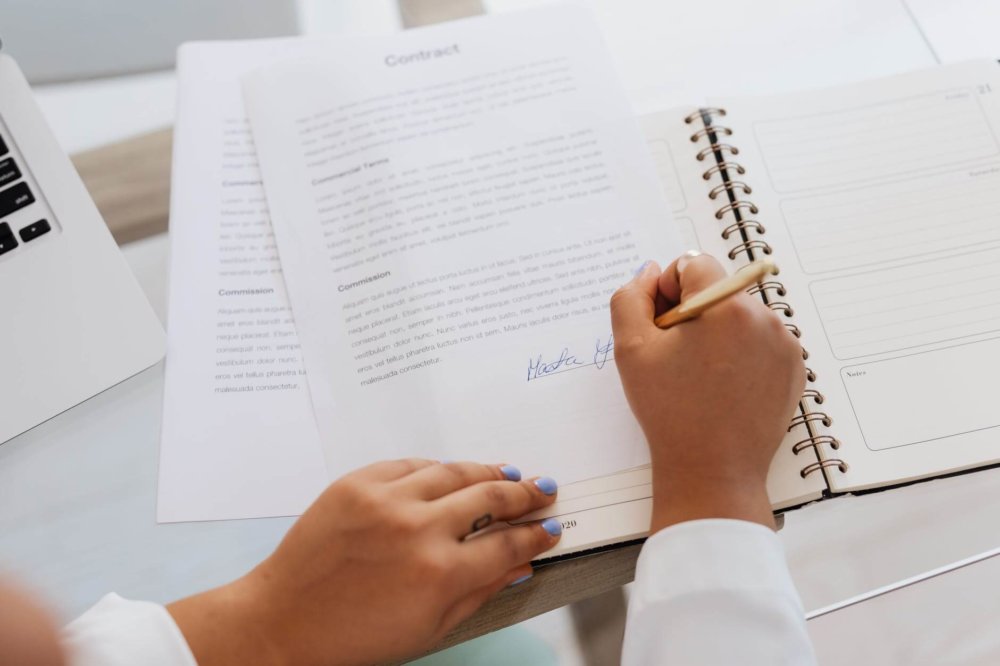 A girl signing a closing contract before long-distance 