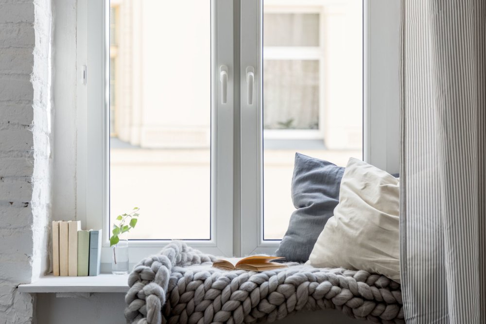 Window sill with pillows and books