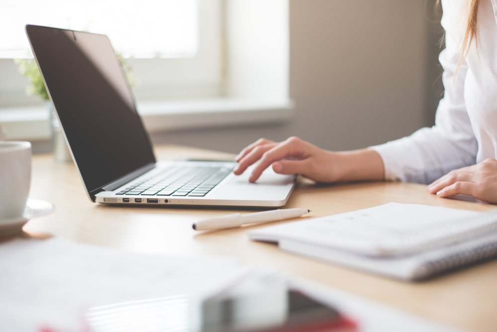 Woman changing the address online before long-distance moving 