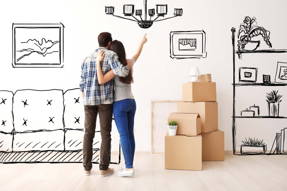 Young couple imagining the interior of their new house