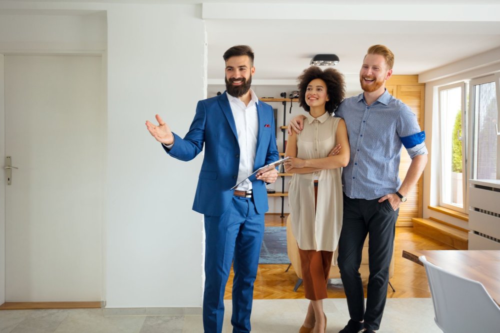 A couple going through a house with a leasing agent