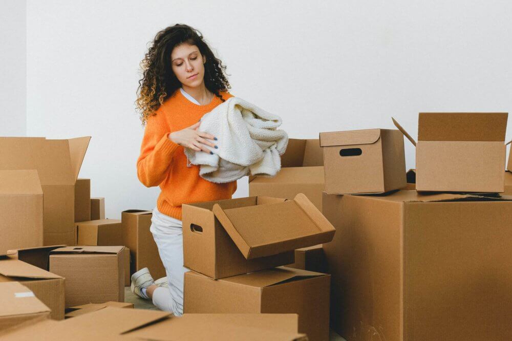 A woman packing a blanket