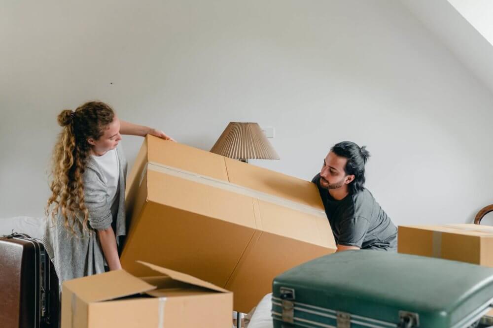 A couple packing their belongings